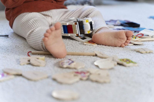 ㅤToddler playing with educational wooden toys to boost development - Mylittleswonder