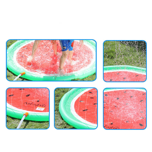 Children playing on a watermelon-themed sprinkler splash pad in the garden.