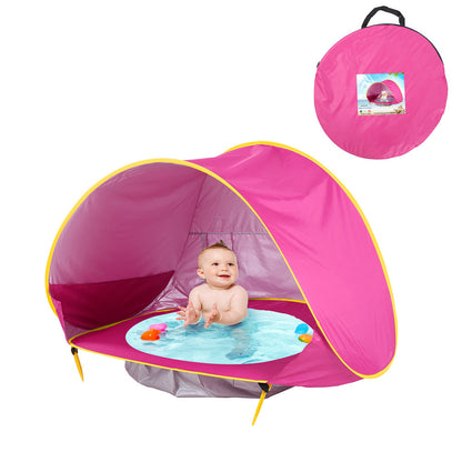 Pop-up baby beach tent with mini pool, UPF 50+ sun protection, waterproof play zone for toddlers on the beach.