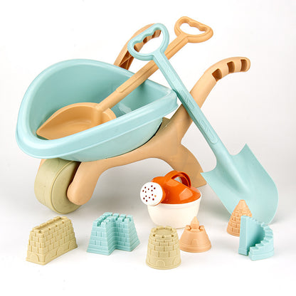 Montessori beach toy set with wheelbarrow, shovels, and sand molds for kids