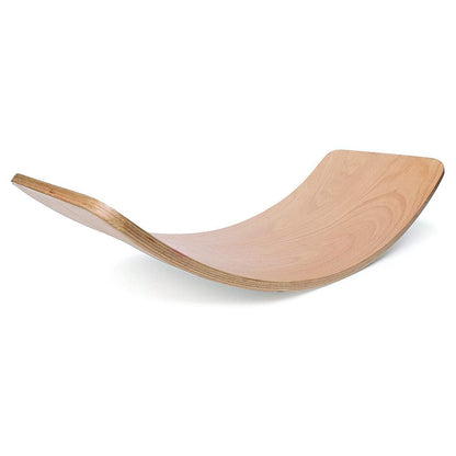 Child playing on Montessori wooden balance board toy for indoor movement and balance training.